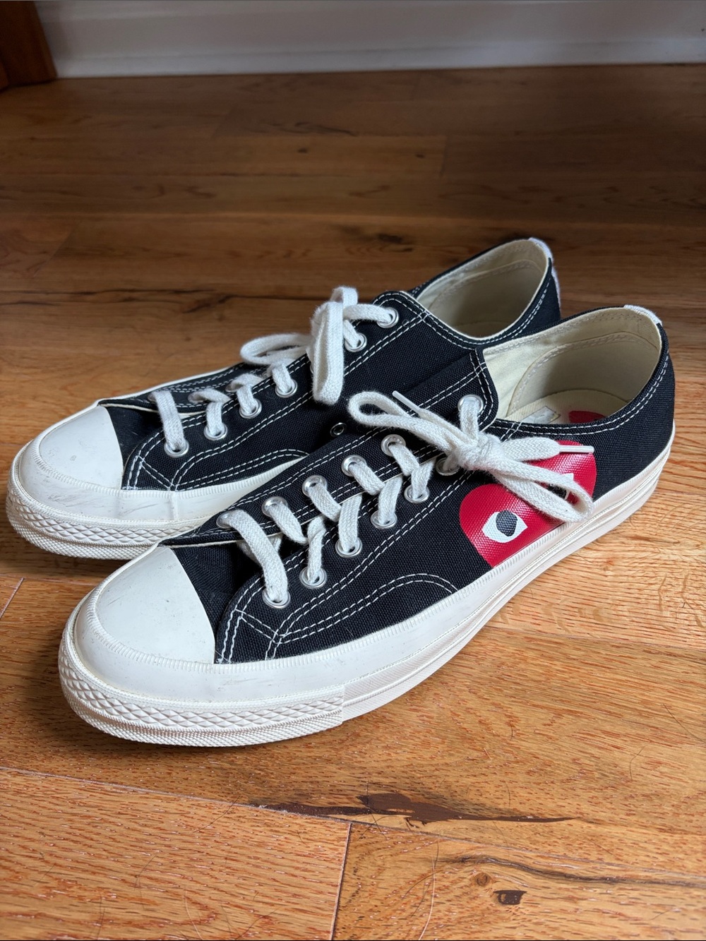 Black Converse x Comme des Garçons sneakers with Red Heart Detail